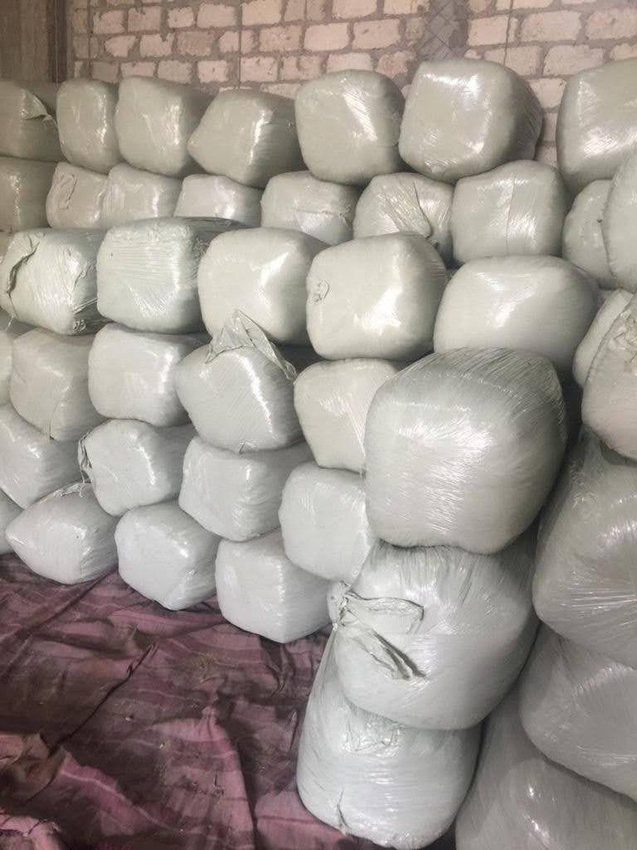 Wrapped bales stacked in store